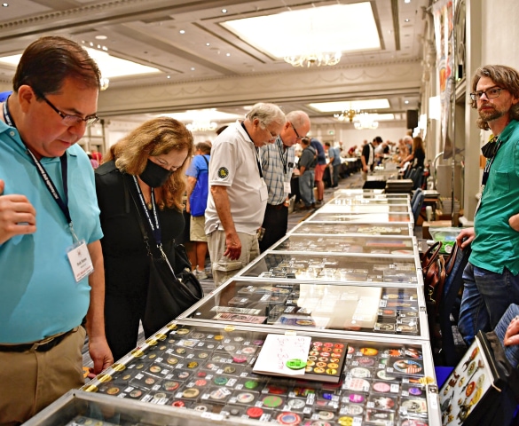 a group of people looking at a display case