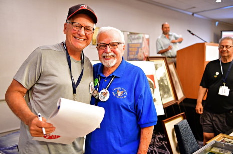 two men standing next to each other
